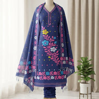 A navy blue embroidered ethnic outfit featuring a kurta with colorful floral patterns and a matching draped shawl. 