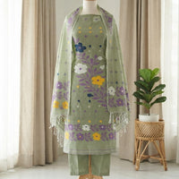 A sage green traditional outfit featuring a matching embroidered dupatta with white fringe.